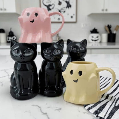 Gia Roma Ghost Mug set includes pink ghost mug, yellow ghost mug and three black cat mugs on Tampa Home & Garden Store