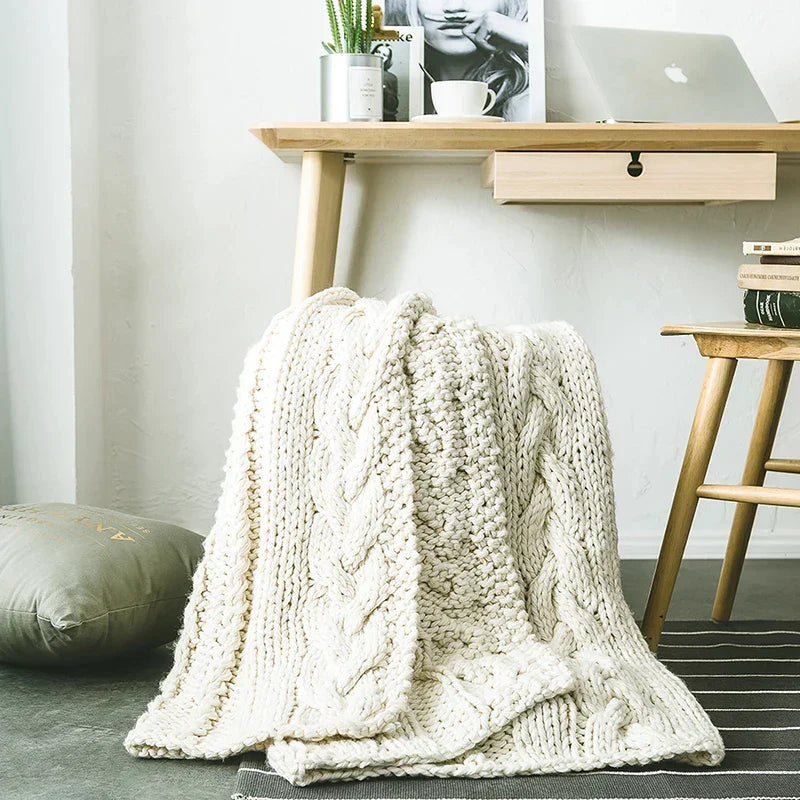 DecorBites Khaki Beige Chunky Knit Wool Blanket draped over a chair, cozy throw on Tampa Home & Garden Store