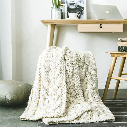DecorBites Khaki Beige Chunky Knit Wool Blanket draped over a chair, cozy throw on Tampa Home & Garden Store