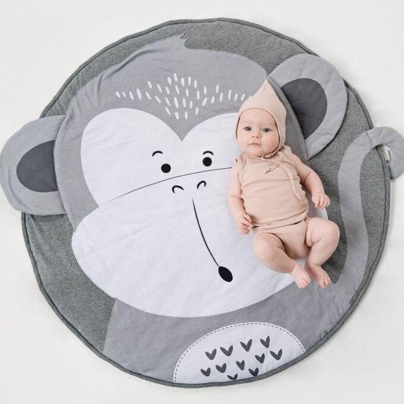 Stevvex round elephant baby play mat, gray cotton, elephant face with ears, baby on mat on Tampa Home & Garden Store