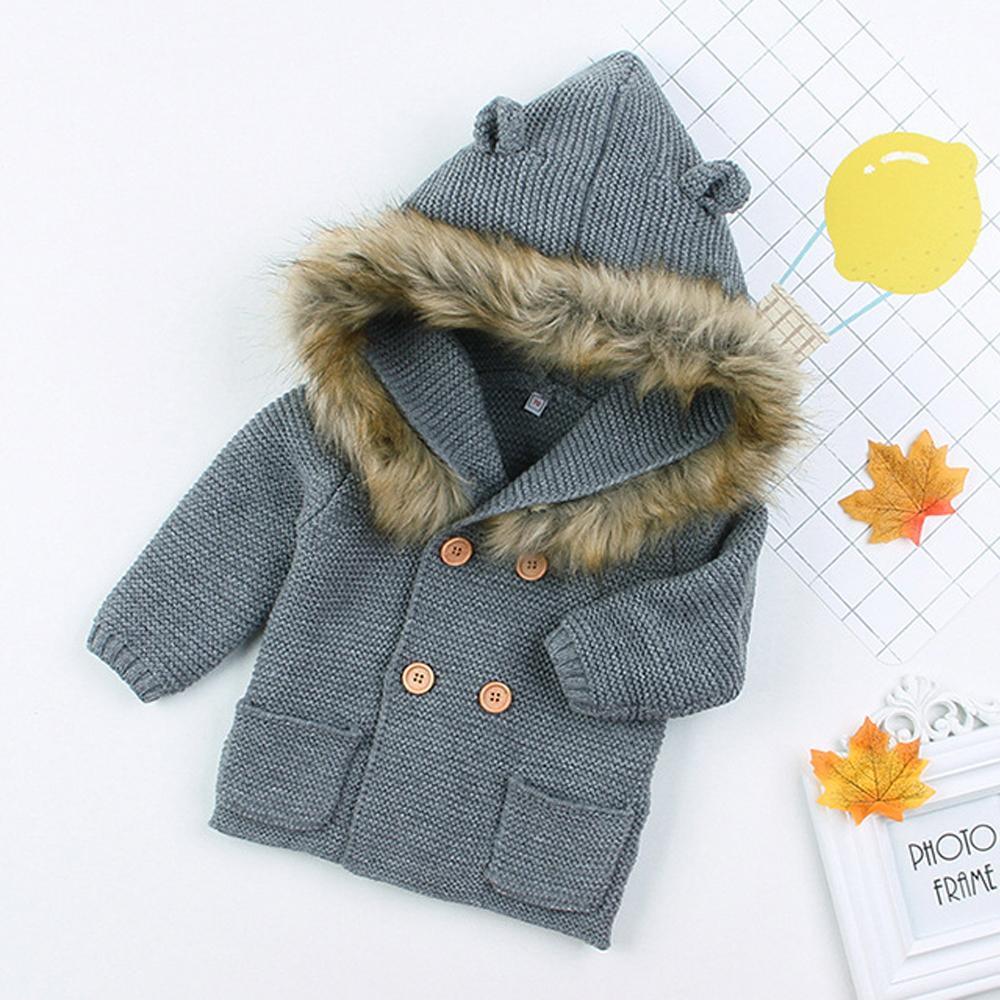 Gray knitted hooded baby coat by Stevvex with faux fur trim, wooden buttons, front pockets on Tampa Home & Garden Store