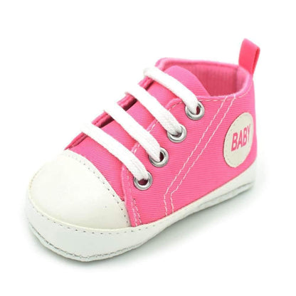 Classic Canvas Walker baby sneaker in pink with white toe cap and laces, anti-slip sole on Tampa Home & Garden Store