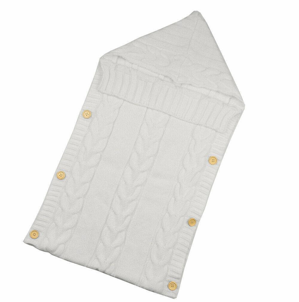 Stevvex knitted white baby swaddle blanket with cable knit pattern and wooden buttons on Tampa Home & Garden Store