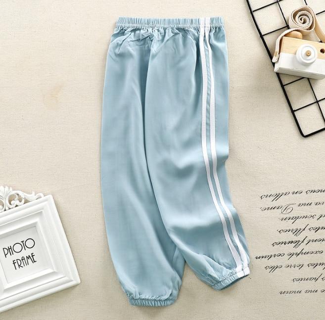 Stevvex kids sport pants light blue with white side stripes, elastic waistband and cuffs on Tampa Home & Garden Store