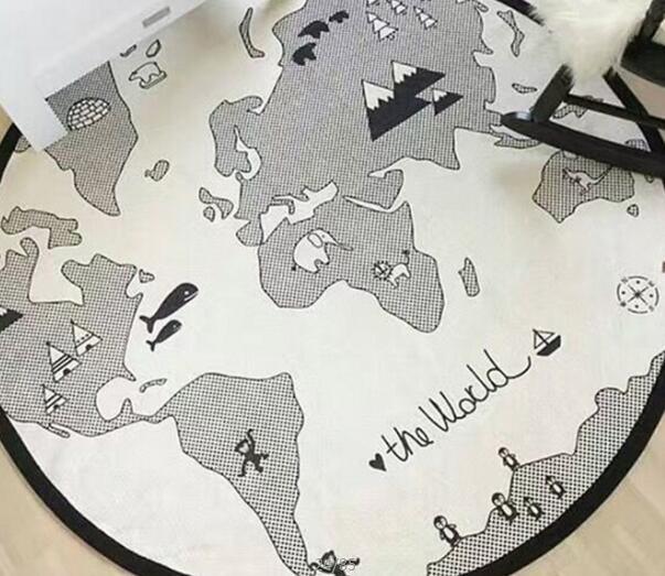 Round cotton baby play mat with a grayscale world map print and black edge trim on Tampa Home & Garden Store