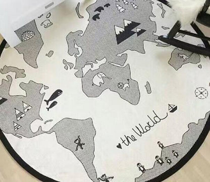 Round cotton baby play mat with a grayscale world map print and black edge trim on Tampa Home & Garden Store