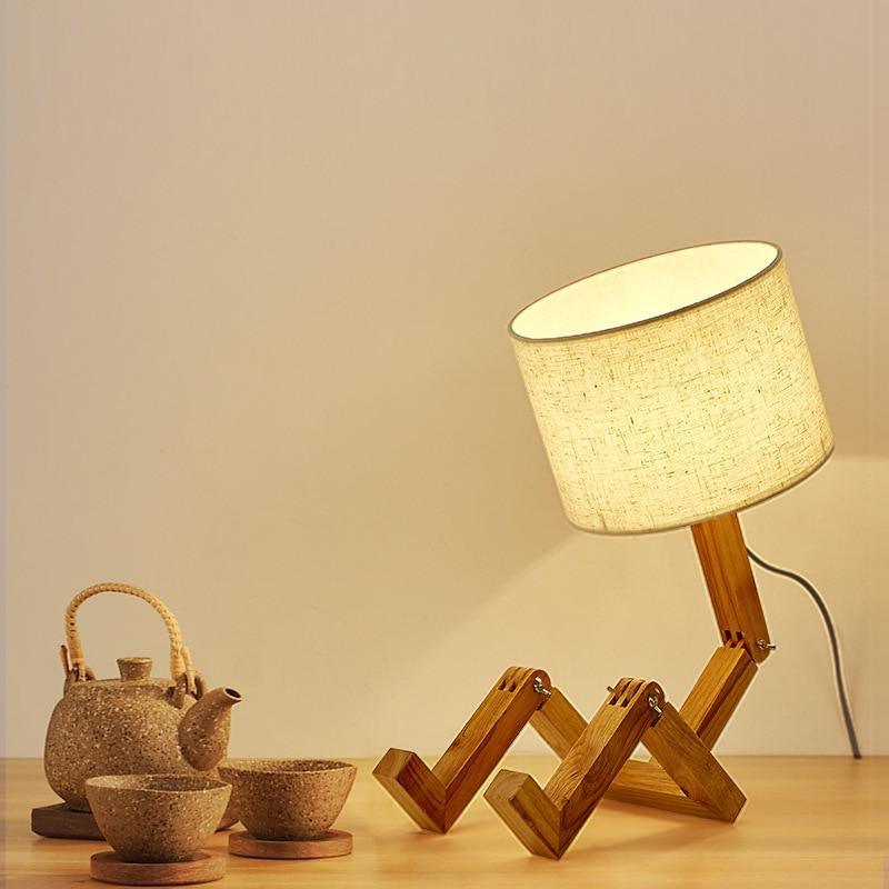 Stevvex wood robot-shape folding table lamp with linen shade on table with teapot and cups on Tampa Home & Garden Store