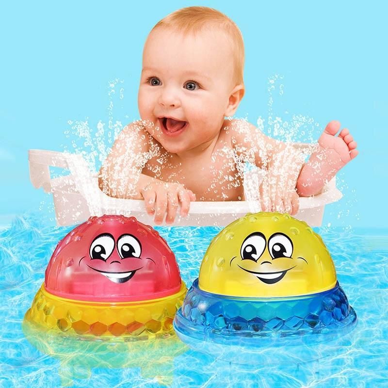 Stevvex LED bath toys, 2 smiling rotating domes red and yellow floating in bath water with baby in tub on Tampa Home & Garden Store
