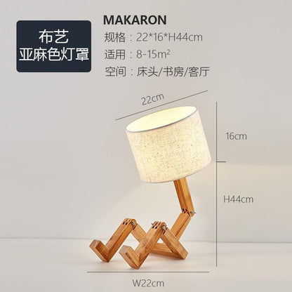 Stevvex wood robot-shaped folding table lamp with beige linen shade on Tampa Home & Garden Store