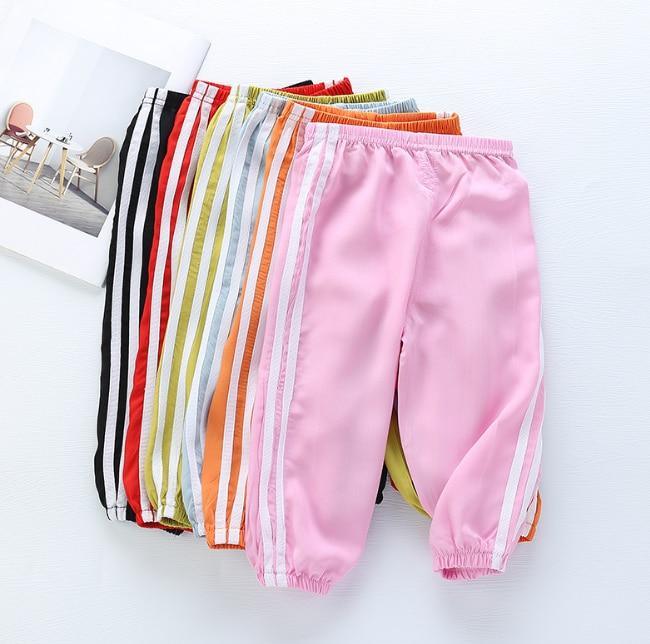 Stevvex kids sports pants pink pair with white side stripes among colorful stacked options on Tampa Home & Garden Store