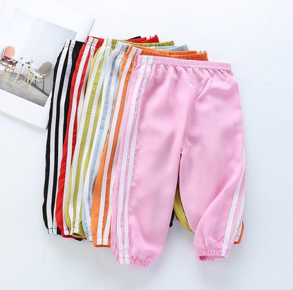 Stevvex kids sports pants pink pair with white side stripes among colorful stacked options on Tampa Home & Garden Store