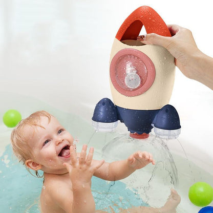 Baby Spin Water Spray Rocket Bath Toy Stevvex with red handle beige body and blue fins on Tampa Home & Garden Store