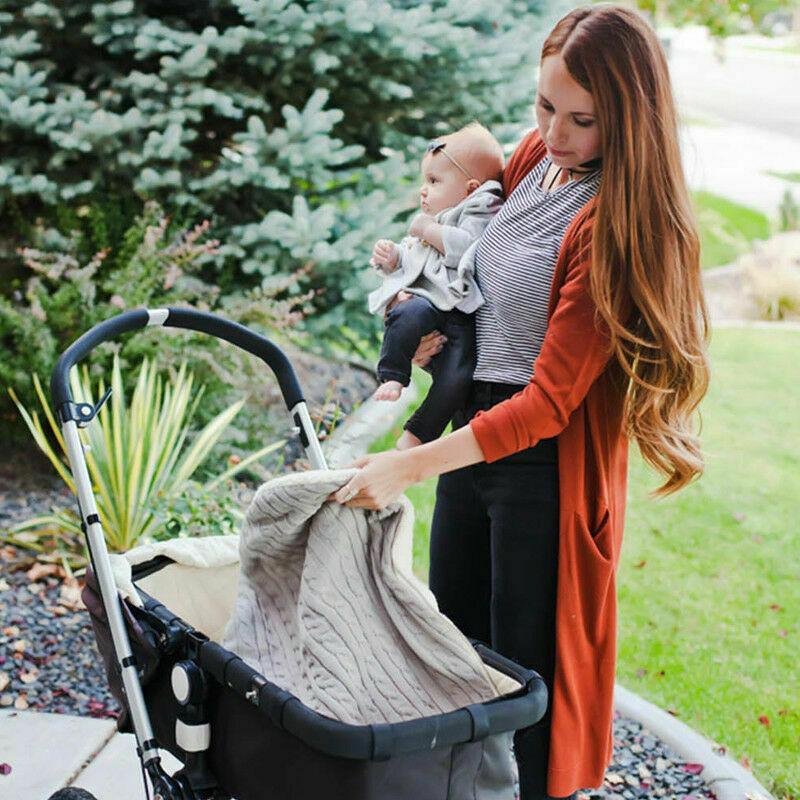 Knitted warm baby blanket swaddle wrap in gray used as stroller footmuff for baby on Tampa Home & Garden Store