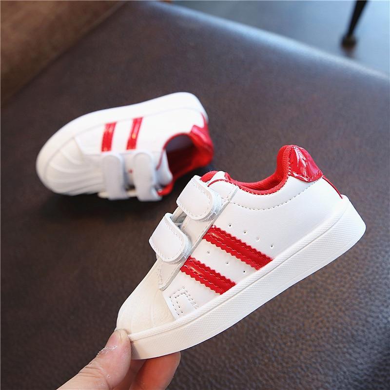 Stevvex white baby sneakers with red stripes, two Velcro straps, red heel trim, white sole on Tampa Home & Garden Store