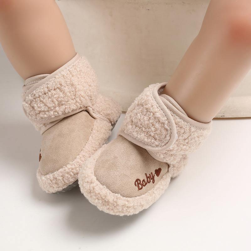 Beige newborn baby booties with Velcro strap and faux shearling trim on Tampa Home & Garden Store