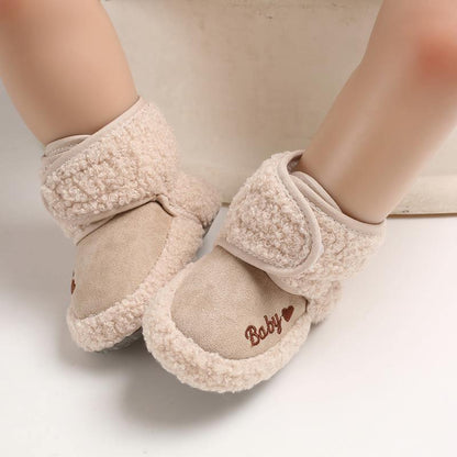 Beige newborn baby booties with Velcro strap and faux shearling trim on Tampa Home & Garden Store