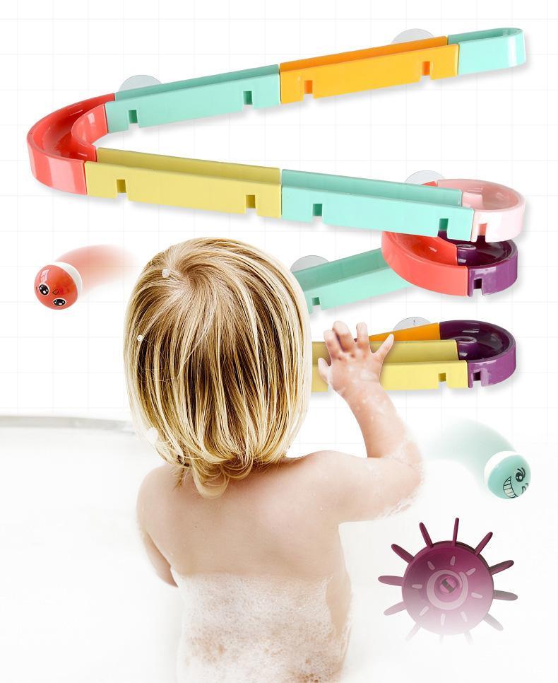 Bath Toys Suction Cup Marble Race Orbits Track set in pastel colors with toddler in tub on Tampa Home & Garden Store