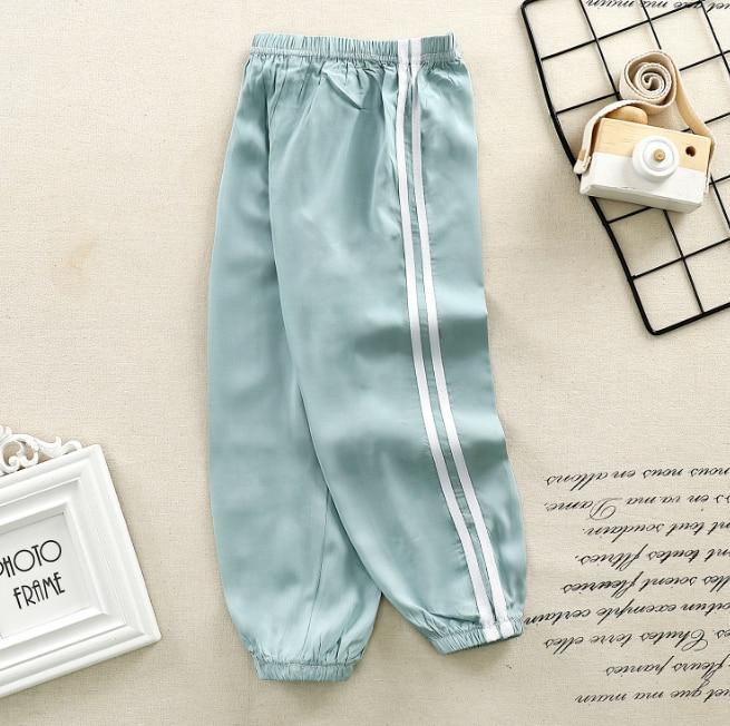 Stevvex kids satin sport pants light blue with white side stripes, elastic waistband on Tampa Home & Garden Store