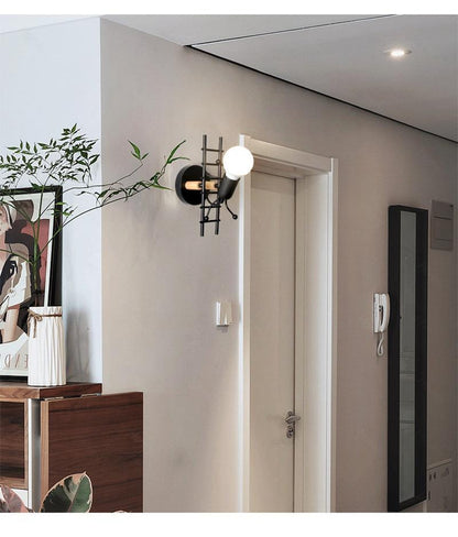 Stevvex wall light ST10LM1584DEW, black ladder-style sconce with exposed bulb on Tampa Home & Garden Store