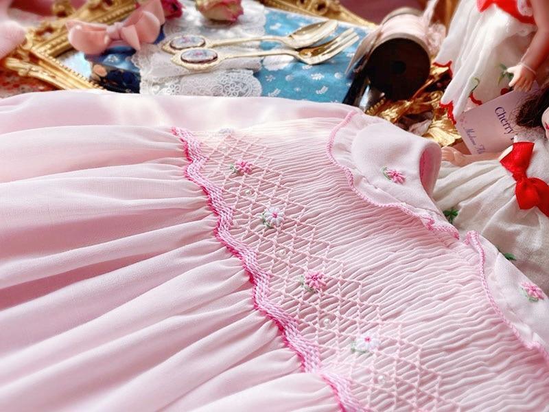 Pink baby girl dress with smocked bodice, floral embroidery and long sleeves by Stevvex on Tampa Home & Garden Store