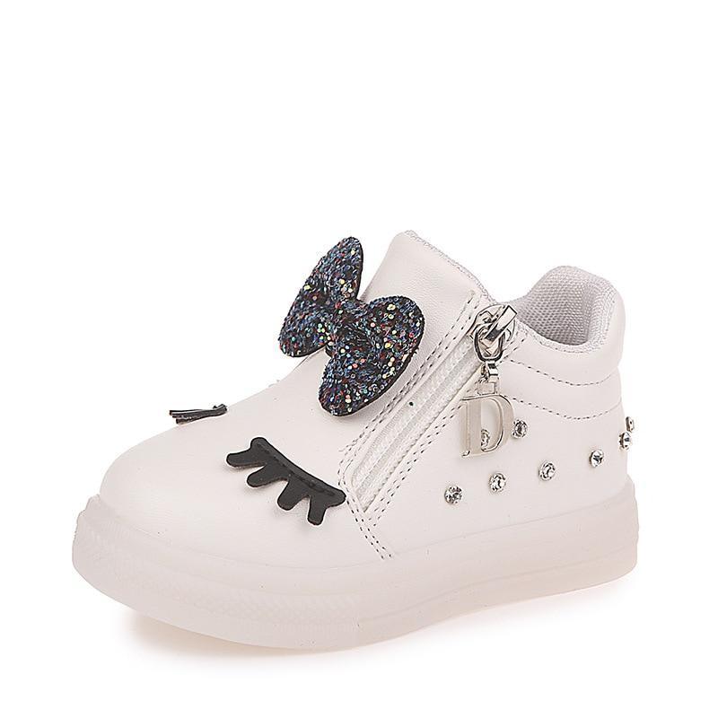 Stevvex white baby sneakers with glitter bow, eyelash applique and rhinestone studs on Tampa Home & Garden Store
