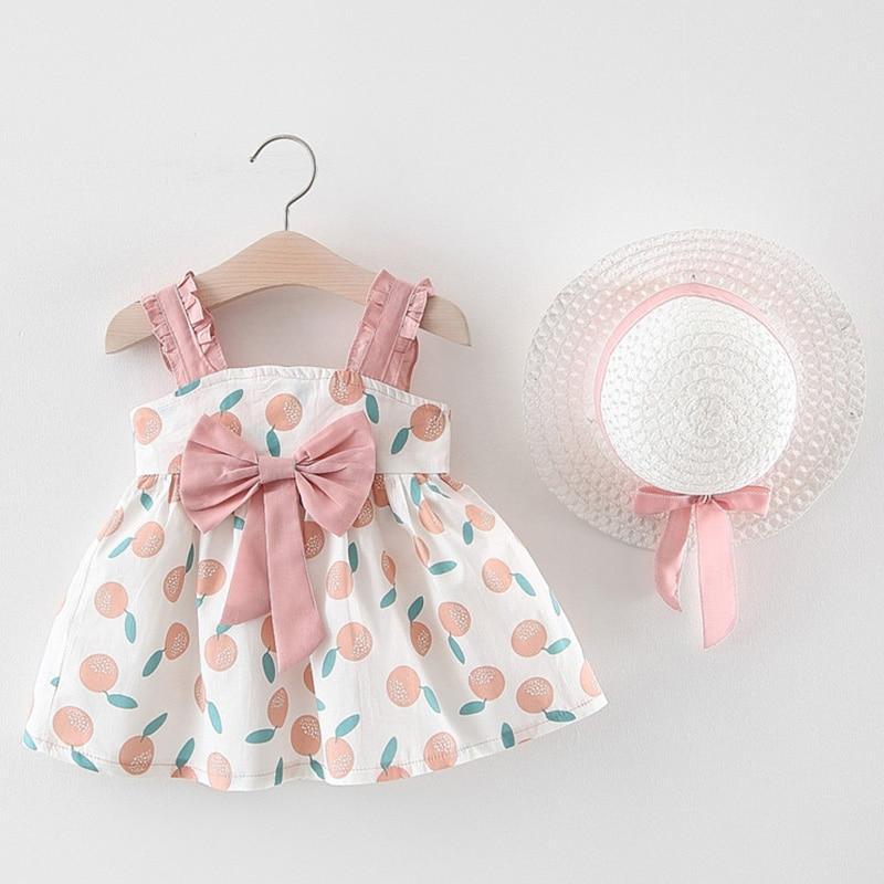 Newborn baby girl dress set with hat by Stevvex, white peach-print pattern with pink bows on Tampa Home & Garden Store