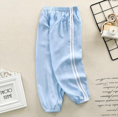 Stevvex kids sports pants light blue with white side stripes, elastic waistband and cuffs on Tampa Home & Garden Store