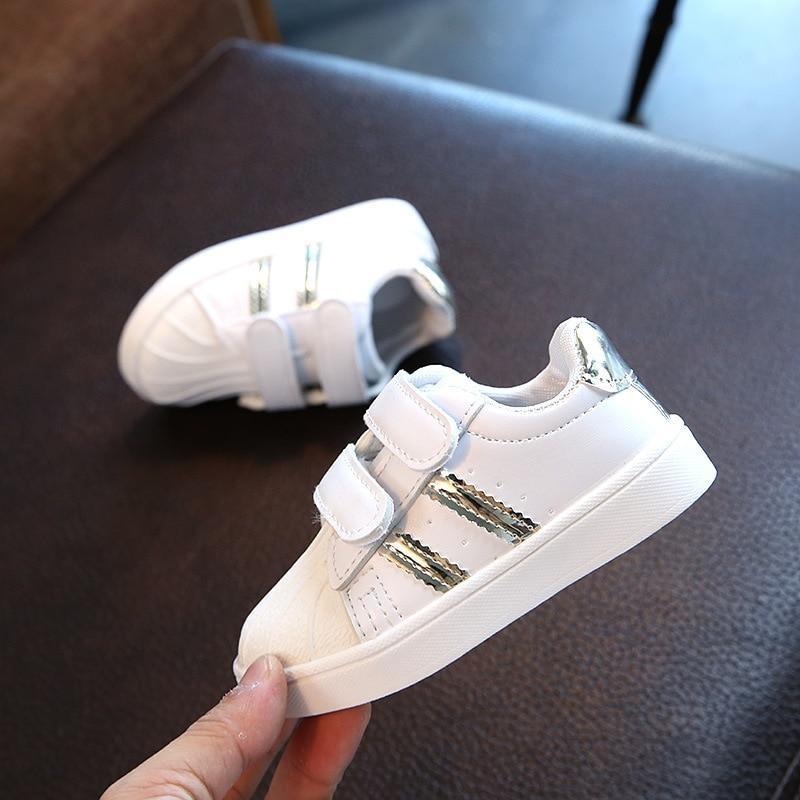Stevvex white toddler sneakers with Velcro closure and silver side stripes on antislip sole on Tampa Home & Garden Store