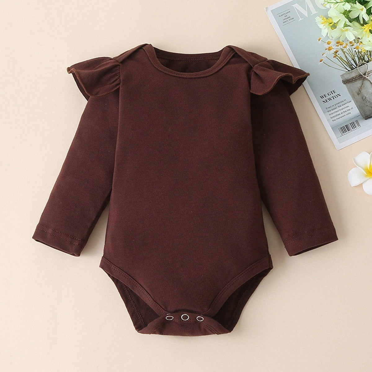 Stevvex newborn brown romper with ruffle shoulder sleeves and snap bottom closure on Tampa Home & Garden Store