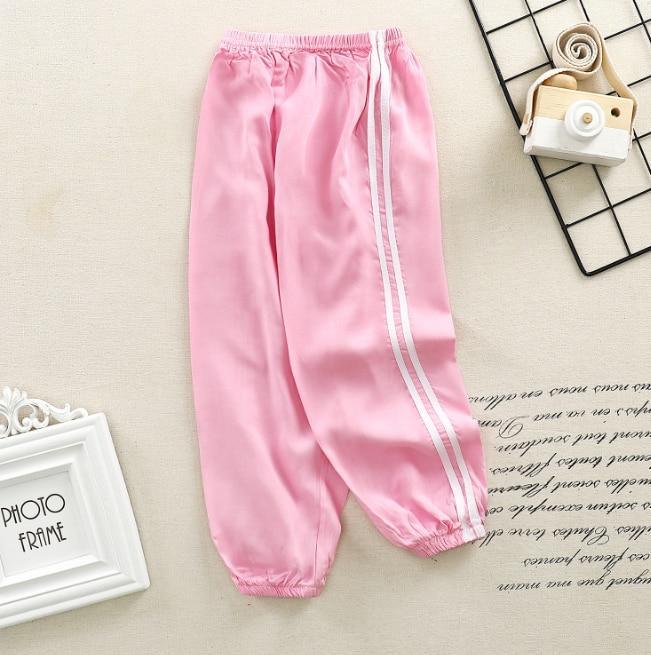 Stevvex pink kids sports pants with white side stripes, elastic waistband and cuffs on Tampa Home & Garden Store