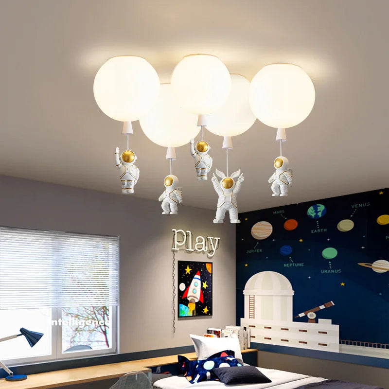 DecorBites Kids Space Balloon LED Ceiling Lamp with globe lights and hanging astronauts on Tampa Home & Garden Store