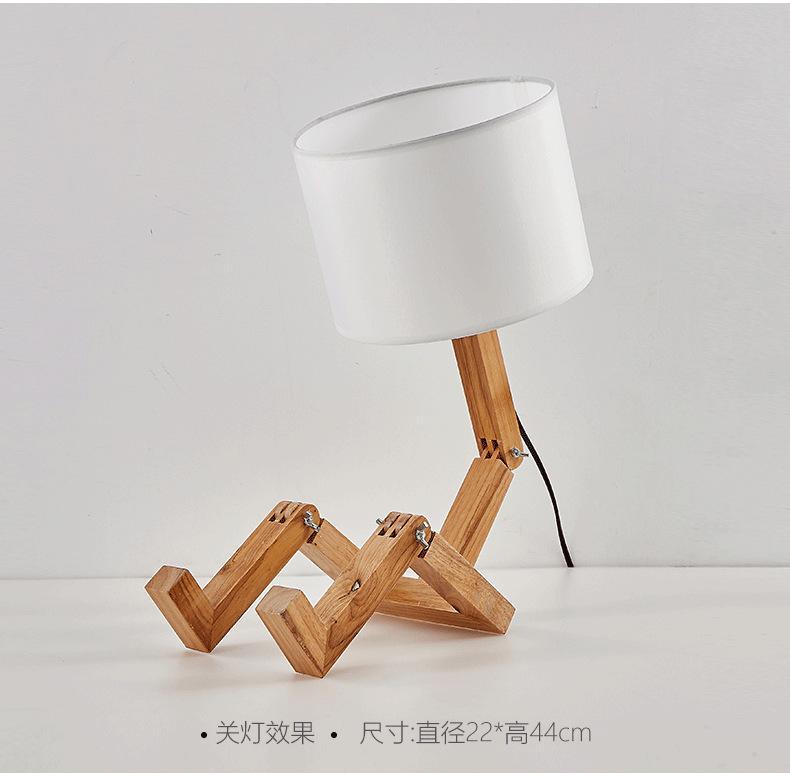 Stevvex ST5LM45021BBG wooden robot-shape folding table lamp with white linen shade on Tampa Home & Garden Store