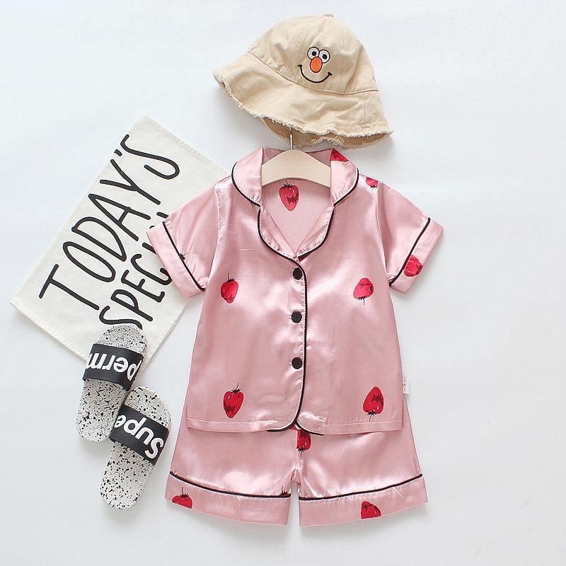 Stevvex pink satin kids pajama set with strawberry print; short-sleeve top and shorts on Tampa Home & Garden Store