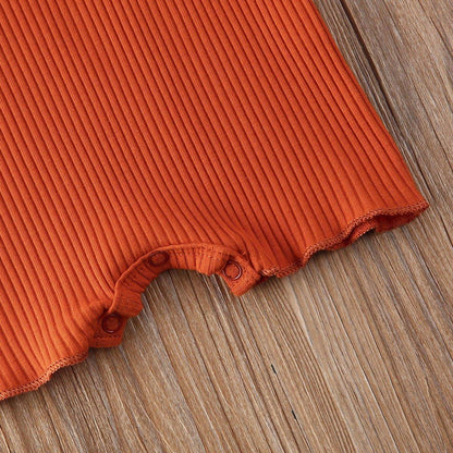 Stevvex orange ribbed cotton baby romper fabric with snap closures along leg opening on Tampa Home & Garden Store