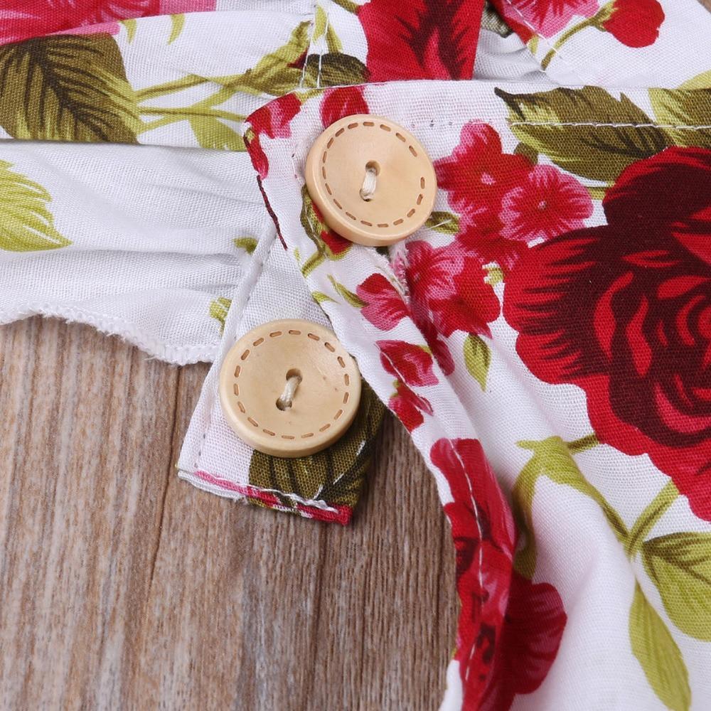 Baby floral romper with red rose print and tan wooden buttons on Tampa Home & Garden Store