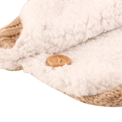 Stevvex white sherpa baby blanket swaddle with tan woven edge and wooden button on Tampa Home & Garden Store