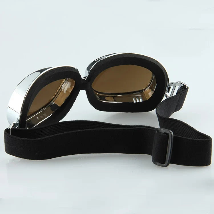 Motorcycle goggles vintage-style with black padded frame and brown tinted lenses on Tampa Home & Garden Store