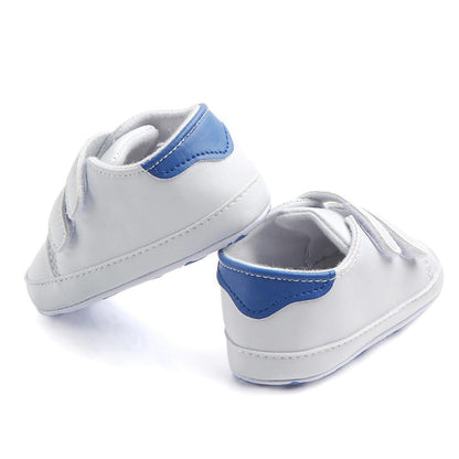 White leather baby shoes pair with blue heel patches, soft sole infant sneakers on Tampa Home & Garden Store