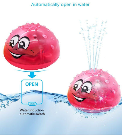 Stevvex pink bath toy ball with smiley face, water-activated switch and water spray effects on Tampa Home & Garden Store