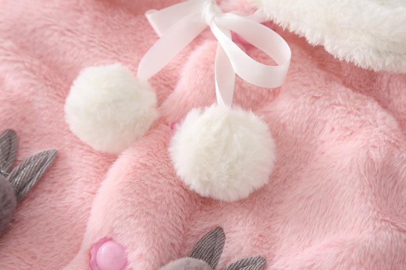 Pink plush baby cloak coat with white pompom tassels and floral accents, toddler size on Tampa Home & Garden Store