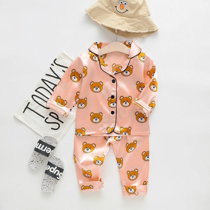 Stevvex pink satin children's pajama set with teddy bear print, long-sleeve top and pants on Tampa Home & Garden Store