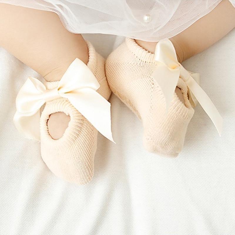 Baby girl anti-slip cotton socks with cream satin bows, peach knit, Stevvex floor socks on Tampa Home & Garden Store