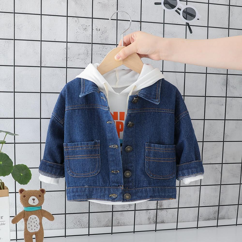 Baby denim padded jacket with front button closure and two patch pockets over a white hoodie on Tampa Home & Garden Store