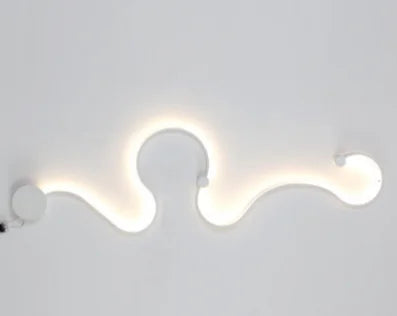 DecorBites LED white aluminum wall lamp with warm backlit wave design on Tampa Home & Garden Store