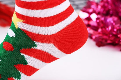 Baby Christmas socks Stevvex; cotton red and white striped with green tree motif on Tampa Home & Garden Store