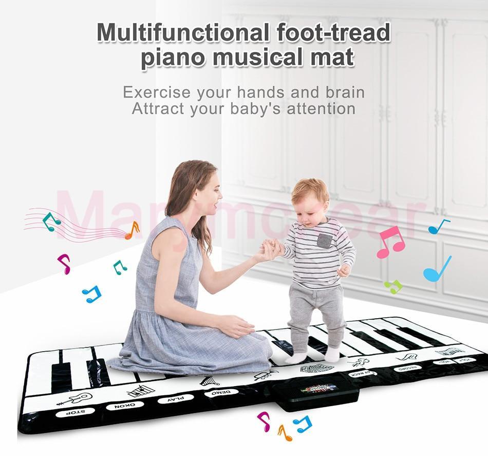 Electronic musical piano mat play rug with black and white keys, toddler with caregiver on Tampa Home & Garden Store