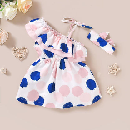 Baby girl dress and headband set in pink and blue polka dots with a ruffle neckline on Tampa Home & Garden Store