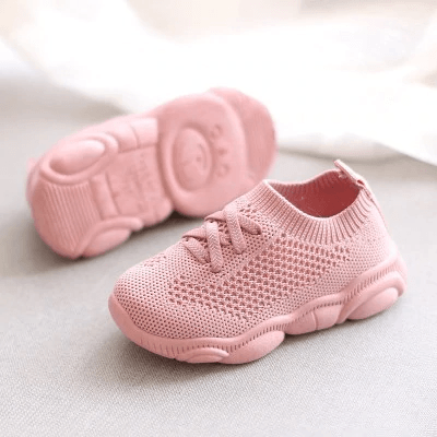 Pair of pink Stevvex baby sneakers with knit mesh upper and anti-slip soft bottom soles on Tampa Home & Garden Store