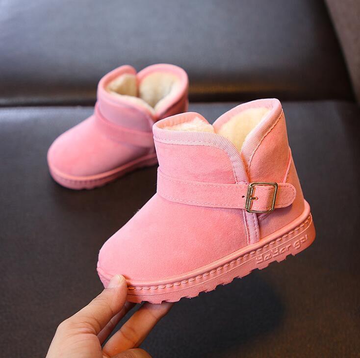 Stevvex pink kids' winter snow boots pair with plush lining and buckle strap on Tampa Home & Garden Store