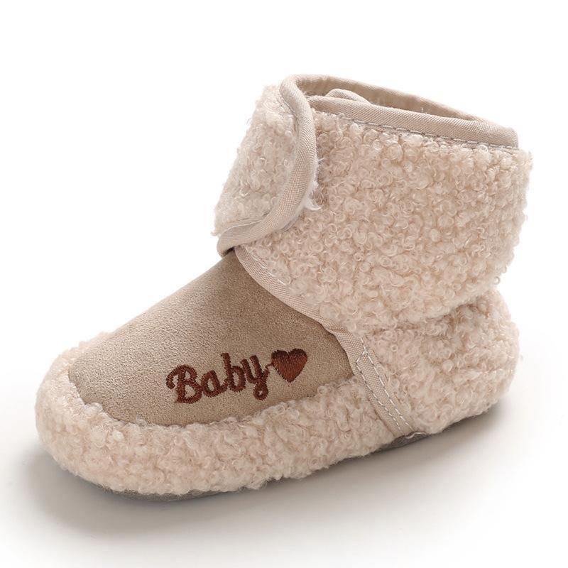 Newborn soft baby bootie in tan faux shearling with embroidered Baby heart on Tampa Home & Garden Store